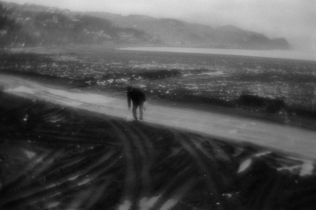 Man is gathering the coal on the beach near Zonguldak. Coal is u