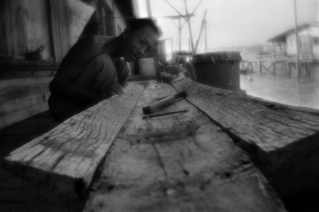 Constructing the boat. The settlement of Sea Gypsies on the Gaya