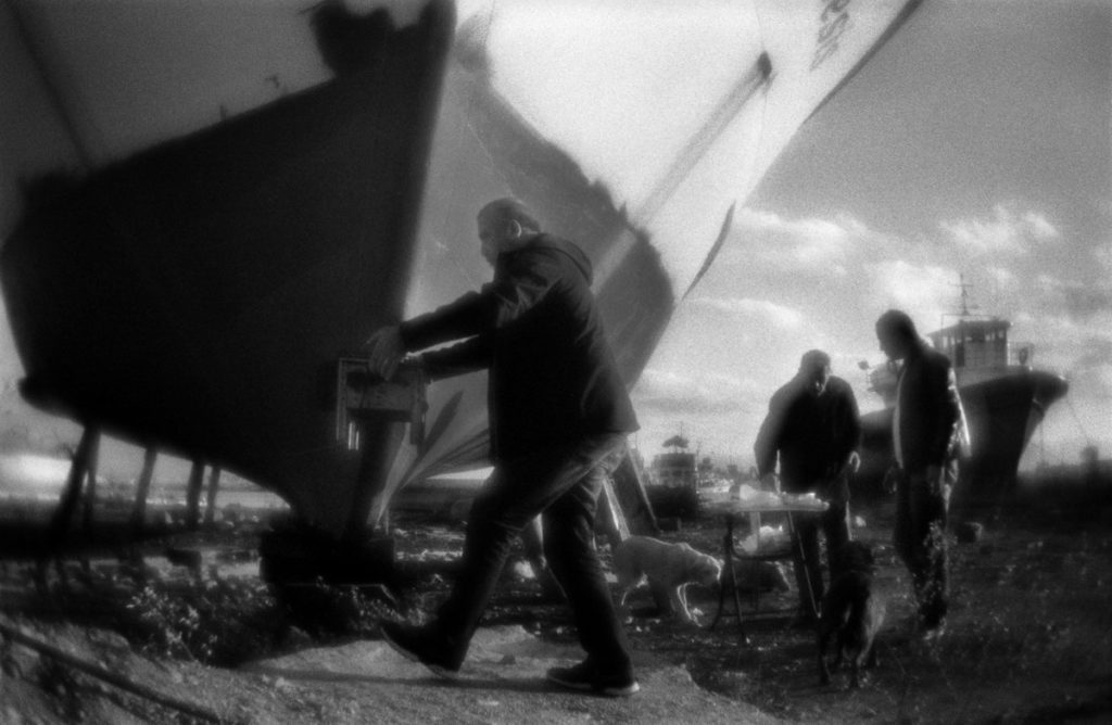 Picniс on the Black sea shore  among the ships parked on the ke